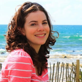 Melissa with ocean waves behind